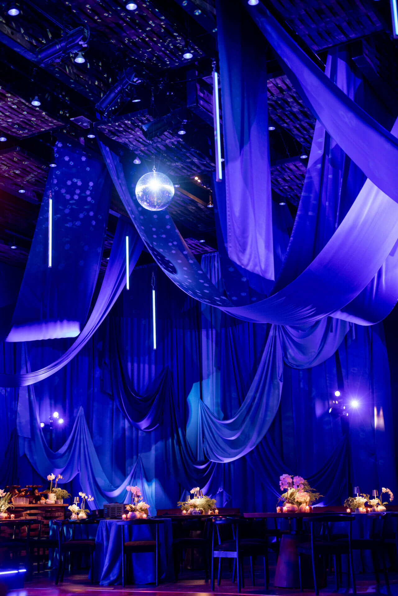 Elegant event venue with blue drapery.