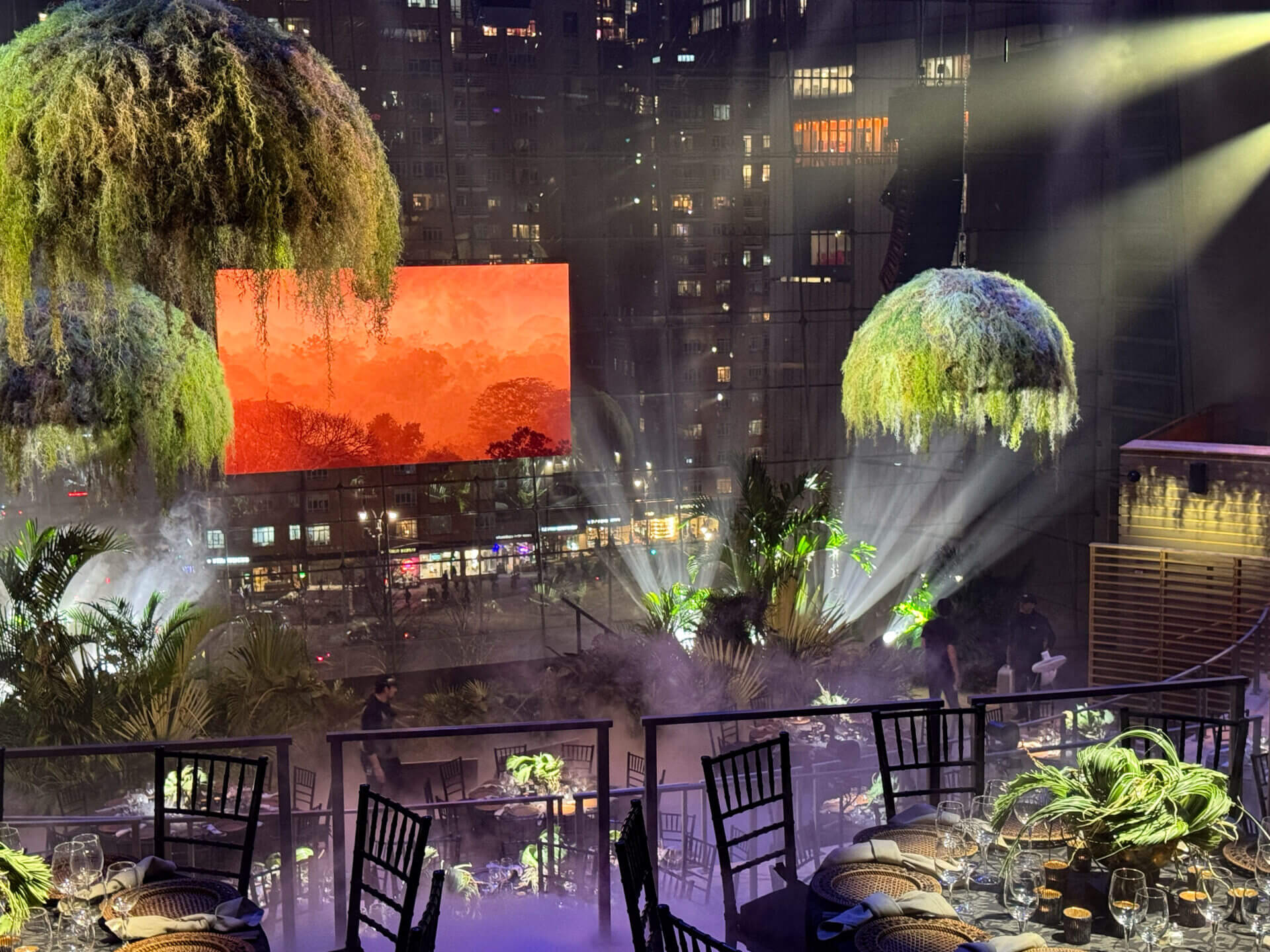 Outdoor event with dramatic lighting and decor.